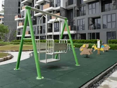 a playground in front of a apartment building at Laguna SkyPark new brand apartments in Phuket Town