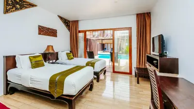 a hotel room with two beds and a television at Blue Bay Resort - Access to Pool and Beach-Phuket & Krabi in Ko Yao Yai