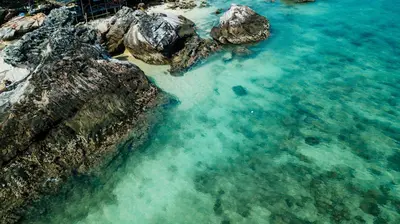 an aerial view of the ocean next to some rocks at Blue Bay Resort - Access to Pool and Beach-Phuket & Krabi in Ko Yao Yai