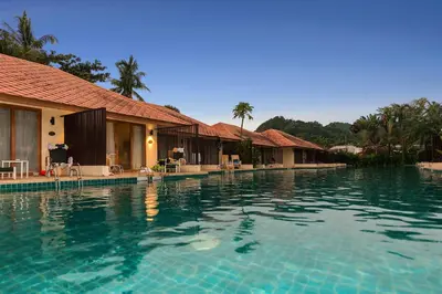 a large swimming pool in front of a resort at Blue Bay Resort - Access to Pool and Beach-Phuket & Krabi in Ko Yao Yai