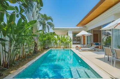 a swimming pool in the backyard of a villa at 3-Bedroom Pool Villa in Trichada Sky at Bangtao in Bang Tao Beach