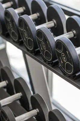 a row of dumbbells on a rack in a gym at Kamala Beach D723 Exclusive 2 bedroom Suite in Kamala Beach