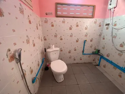 a bathroom with a toilet and a shower at Kanitta Homestay kohyaonoi in Ban Bang Chak