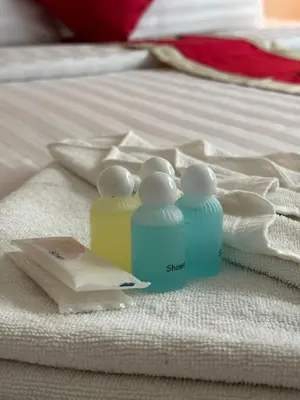 a group of bottles sitting on top of a bed at Istanbul Boutique Hotel in Patong Beach