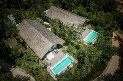 an overhead view of a house with two swimming pools at Villa Escape Burasari in Phuket Town