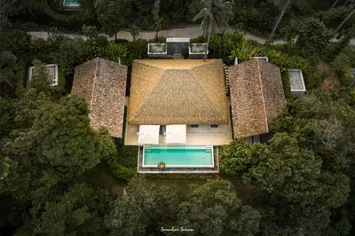 an overhead view of a house with a swimming pool at Villa Escape Burasari in Phuket Town