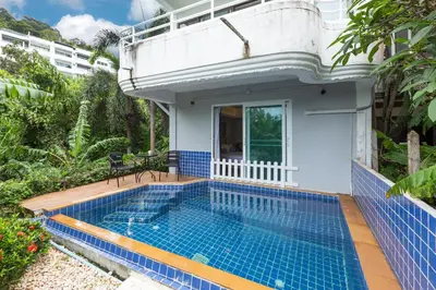 a swimming pool in the backyard of a house at 5BR Jungle Seaview Villa Patong in Patong Beach
