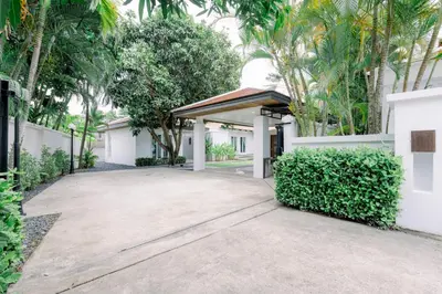 a driveway leading to a house with trees at Luxurious Residence Rawai in Phuket Town