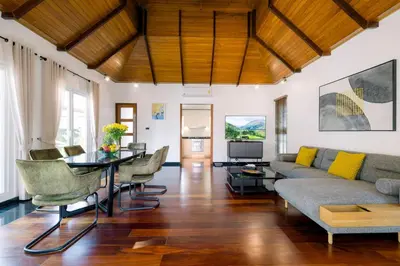 a living room with a couch and a table at Luxurious Residence Rawai in Phuket Town
