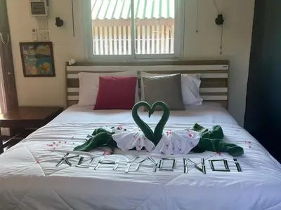 a bed with a heart decoration on top of it at Banpoo in Ko Yao Noi