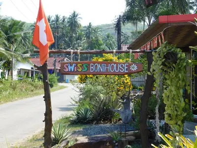 a sign for theiss bourn house on a street at Swiss Bonihouse Koh Yao Yai in Ban Phlu Nai