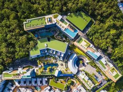 an aerial view of a mansion with a swimming pool at The Panora apartments by NLA in Surin Beach