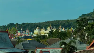a view of a town with buildings and trees at Kefir Phuket in Kamala Beach
