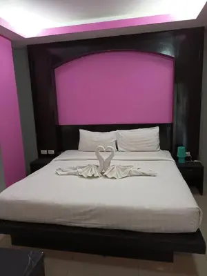 a bed with a heart on top of it at New Lavender Hotel Patong in Patong Beach
