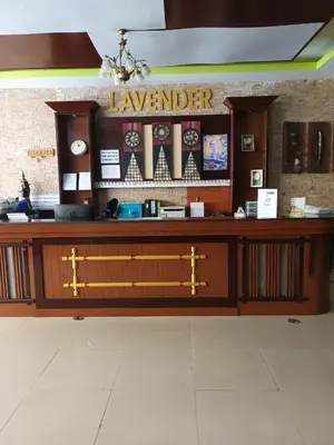a lobby with a large counter with a bench at New Lavender Hotel Patong in Patong Beach
