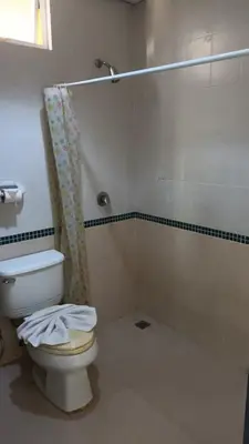 a bathroom with a toilet and a shower at New Lavender Hotel Patong in Patong Beach