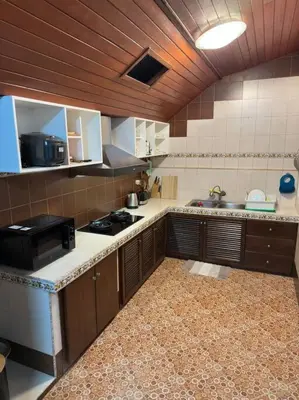 a kitchen with a sink and a stove in it at Kathu Home with Mountain View in Kathu