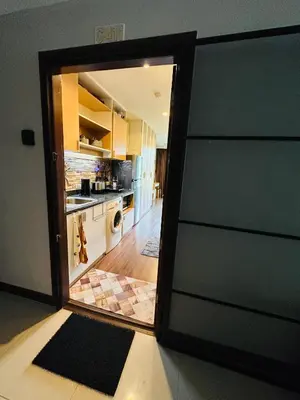 a view of a kitchen through a door at Brand Naithon Condo C411 in Nai Thon Beach