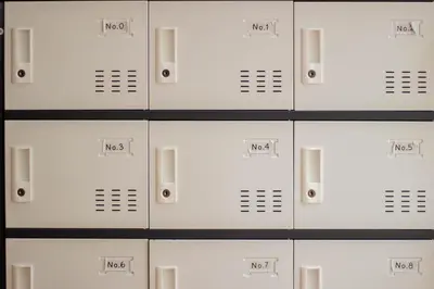 a row of white lockers in a locker room at Beds Friends Phi Phi Hostel - Party Hostel in Phi Phi Don