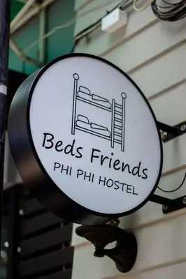 a mirror with a sign that reads beds friends phil phili hospital at Beds Friends Phi Phi Hostel - Party Hostel in Phi Phi Don