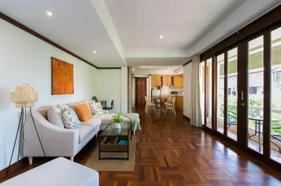 a living room with a couch and a table at Katamanda 1Bedrooms Apartment near Kata Beach in Kata Beach