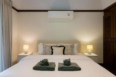 a bedroom with a bed with two towels on it at Katamanda 1Bedrooms Apartment near Kata Beach in Kata Beach