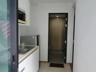 a bathroom with a sink and a shower backdoor at Apartment near Central phuket in Phuket Town