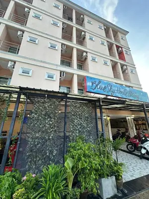 a building with a sign on the front of it at Blueskyhouse Patong in Patong Beach