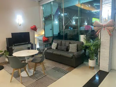 a living room with a couch and a table at The Great @Patong Hotel in Patong Beach