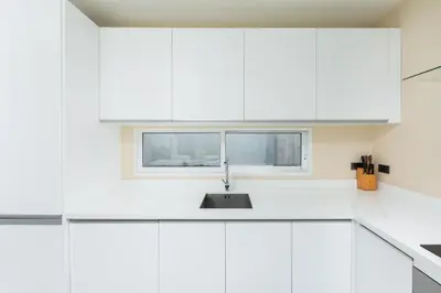 a white kitchen with a sink and a window at Villa Maya 2BR private pool villa Nai Harn beach in Rawai Beach