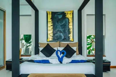 a bedroom with a bed with a blue heart on it at Zen Private Pool Villa Little Paradise in Rawai Beach