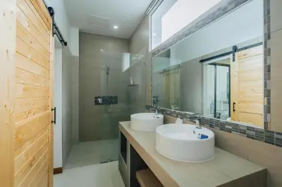 two white sinks in a bathroom with a shower at Zen Private Pool Villa Little Paradise in Rawai Beach
