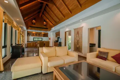 a living room with two couches and a table at Solas Pool Villa Grand Villa With Private Pool in Rawai Beach