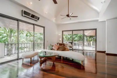 a living room with a couch and a table at Orchid Pool Villa Lavish Villa In Perfect Location in Rawai Beach