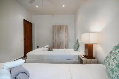 a white bedroom with two beds and a lamp at Orchid Pool Villa Lavish Villa In Perfect Location in Rawai Beach