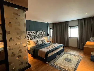 a bedroom with a bed in a room at Fantastic Karon Beach guest house in Karon Beach