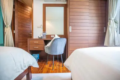 a bedroom with a mirror and a chair and a desk at Phuket Boutique Pool Villa-80 in Rawai Beach