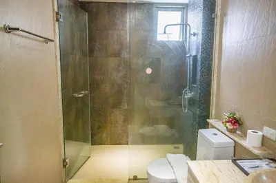 a bathroom with a glass shower with a toilet at Phuket Boutique Pool Villa-80 in Rawai Beach