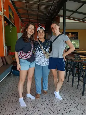 three women posing for a picture in a room at The view Hostel in Phi Phi Don