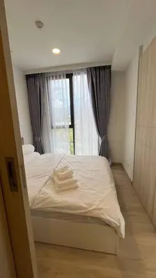 a bedroom with a white bed with a window at Laguna Sky Park Corner 1 Bedroom in Bang Tao Beach