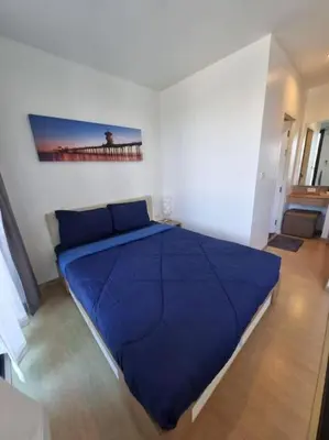 a bedroom with a large blue bed in a room at Lovely apartment in Bang Tao - Zcape X2 Condo in Phuket Town