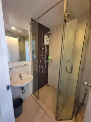 a bathroom with a shower and a sink at Lovely apartment in Bang Tao - Zcape X2 Condo in Phuket Town