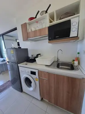 a kitchen with a washing machine and a sink at Lovely apartment in Bang Tao - Zcape X2 Condo in Phuket Town