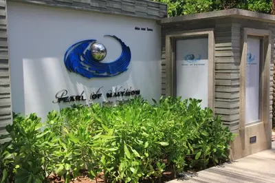 a building with a sign that reads rent of vibration at Naithon beach WERT in Phuket Town