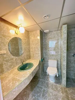 a bathroom with a sink and a toilet at Upsea patong in Patong Beach