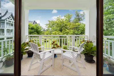 a balcony with a table and two chairs at Spacious 2BR Apartment ALM 2223 in Laguna, 10 min from BangTao Beach in Bang Tao Beach