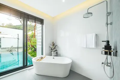 a white bathroom with a tub and a sink at New 3BR Private Pool Villa with 5 Stars Resort Service in Rawai Beach