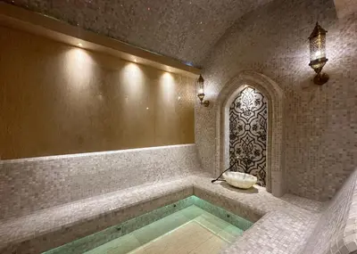 a bathroom with a bath tub with a window at La Green Hotel and Residence in Bang Tao Beach