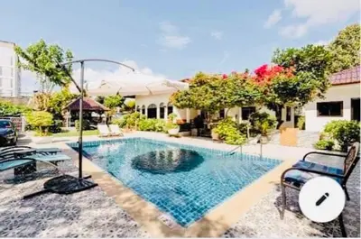 a swimming pool in the backyard of a house at Master Bedroom with private bathroom and kitchen in Phuket Town