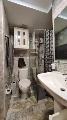 a bathroom with a shower and a toilet and a sink at CB408 Apartament Beach condo 777 in Phuket Town